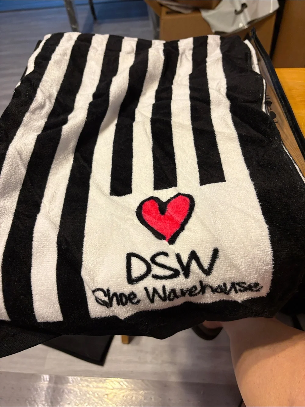 DSW Clear Pouch with Black Shoe Silhouettes and Red Accents with beach towel